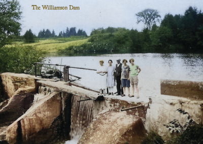 Postcard of people standing on the Williamson Dam